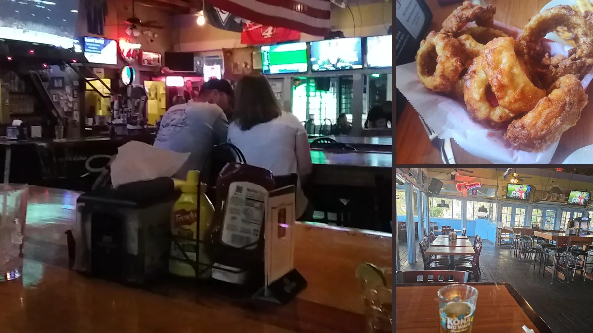 Sports screens above tables and booths.