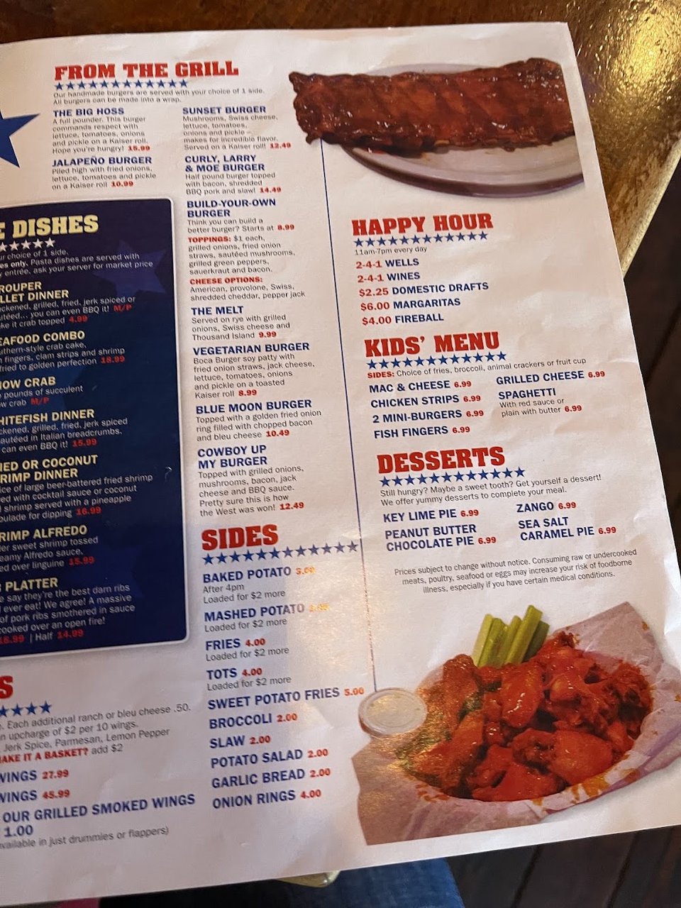Printed menu with appetizers, salads, and sandwiches.